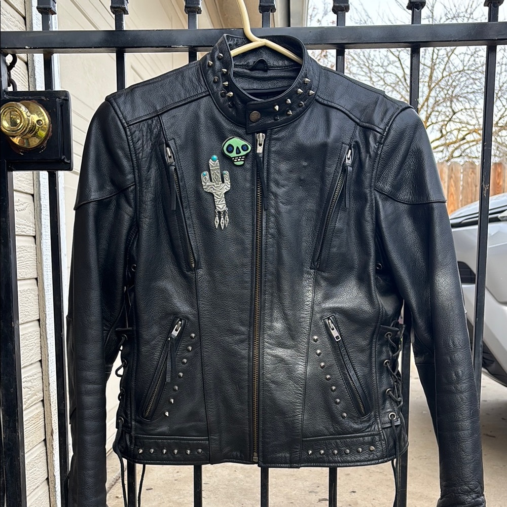Black Leather Motorcycle Jacket with Zippers and Stand-Up Collar.